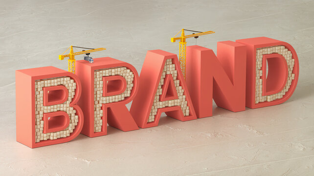 3D rendering of the word BRAND, coral-colored letters filled with small beige cubes, two yellow cranes building, symbolizing brand creation and development