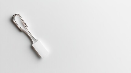 Simple Metal Hook with White Handle on Clean Surface for Display Use