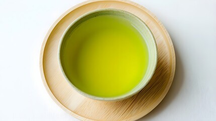 Cup of Green Tea on a Round Wooden Plate for a Tranquil Moment