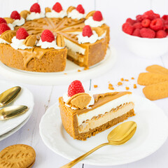 No-Bake Lotus Biscoff Cheesecake with Whipped Cream and Raspberries.