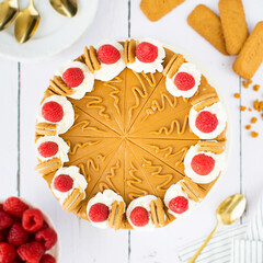 No-Bake Lotus Biscoff Cheesecake with Whipped Cream and Raspberries.