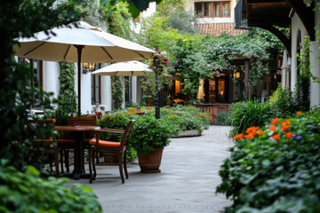 Fototapeta premium Serene outdoor patio surrounded by lush greenery and colorful flowers in a charming courtyard setting