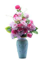 A stunning arrangement of pink roses peonies and lush greenery in a decorative ceramic vase creating a beautiful and elegant display
