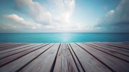 Fototapeta premium Wooden fishing dock with only the blue ocean in color beneath a cloudy sky
