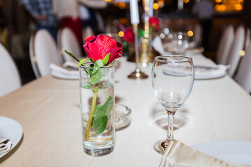 Elegant Table Setting with Red Rose for Romantic Dinner or Celebration