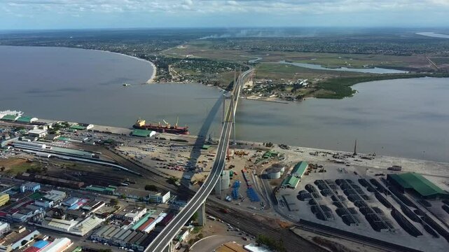 Aerial descending shot in front of the Maputo&ndash;Katembe bridge, in sunny Mozambique