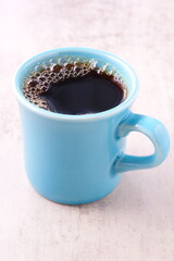 淹れたてのフレッシュで香りのよいコーヒーが入ったコーヒーカップ
