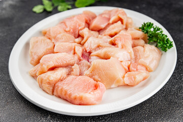 Chicken raw meat pieces of meat poultry tasty fresh delicious gourmet food background on table rustic food top view copy space keto and paleo diet