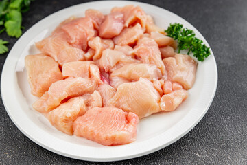 Chicken raw meat pieces of meat poultry tasty fresh delicious gourmet food background on table rustic food top view copy space keto and paleo diet