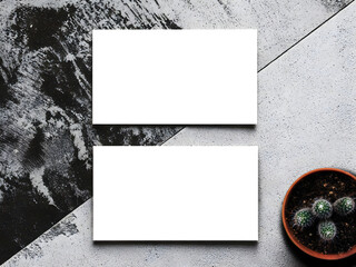 A rendered mockup of business cards on a grunge background