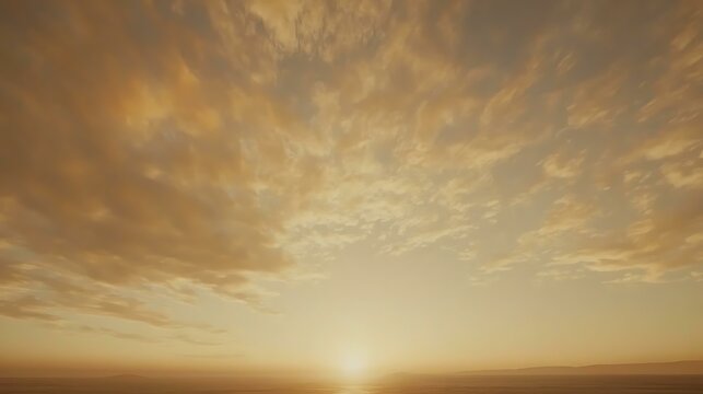 Radiant morning sky with fluffy clouds glowing in soft golden hues, evoking peace and inspiration