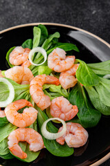 Shrimp salad prawns seafood dish fresh gourmet food background on table rustic food top view copy space