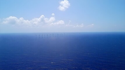 Obraz premium Aerial View of Ocean Wind Turbines in Clear Blue Sky