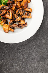Mushroom fried champignon vegetable dish fresh gourmet food background on the table rustic food top view copy space vegetarian and vegan food