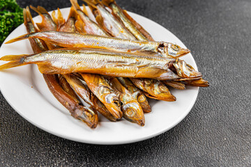 Smoked fish capelin sprat fresh dish gourmet food background on table rustic food top view copy space  