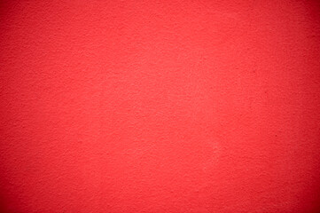 Fototapeta premium rough cement wall painted red