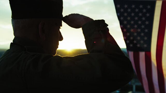 Silhouette Of A Veteran Soldier Facing The Sunlight 