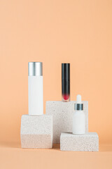 Plastic white tube for cream or lotion. Skin care or sunscreen cosmetic with stylish props on cream background.