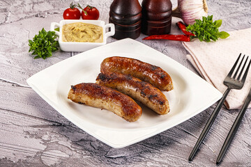 Delicous natural roasted sausages in the plate