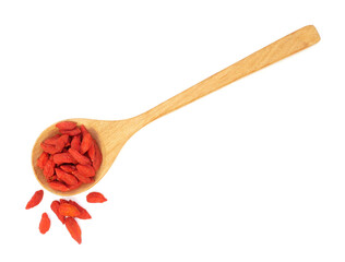 Dried goji berries in spoon isolated on white background