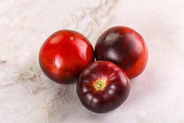 Black ripe juicy organic tomato