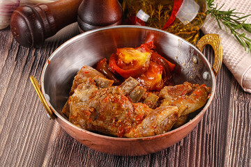 Baked lamb ribs with vegetables