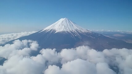 Snow Capped Mountain Peak Above Clouds Aerial View