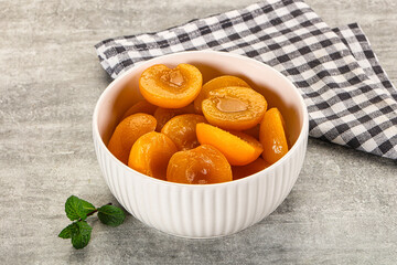 Sweet canned apricots with syrope