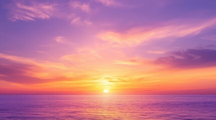 Obraz premium A vibrant sunset over a tranquil ocean.