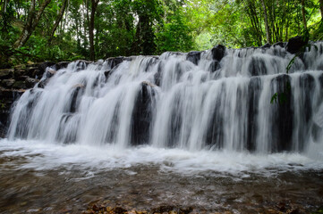 Beautiful Small Waterfall in Green Forest in jungle
