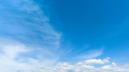Blue sky with clouds, ideal for backgrounds.