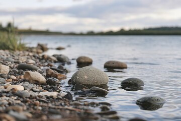 round stones of various sizes on the lakeshore
