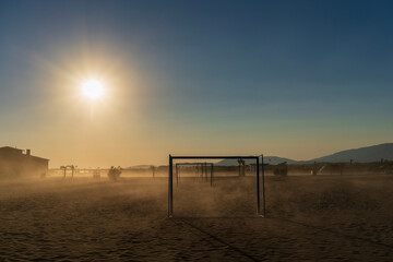 landscape with a soccer field on a beach on a hot summer day © czamfir