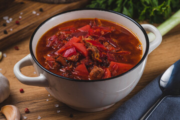 Borscht in a plate on the table