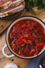 Borscht in a plate on the table