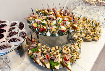 A beautifully arranged buffet featuring a variety of appetizers, snacks, and desserts on a table.