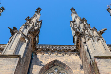 Fototapeta premium HDR image of Ulm Minster, the tallest church in the world, showcasing Gothic details under a clear blue sky on a sunny day. Perfect for travel, architecture, historical and inspiring design projects.