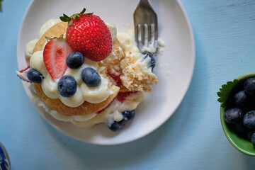 Mille-feuille cake of homemade puff pastry with strawberries and blueberries