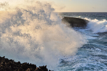 waves crashing on rocks