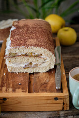 apple cinnamon sponge roll cake with cream cheese and caramelized apples