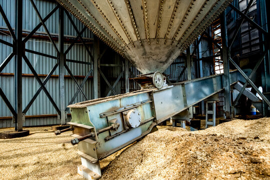 Agro manufacturing plant equipment. Elevator granary warehouse. Harvest time