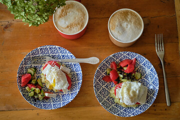 Breakfast, poached egg, salad, sandwich, toast.
