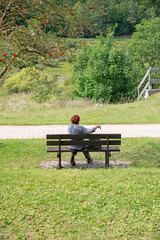 Solitary Moment on a Bench in a Peaceful Countryside Landscape