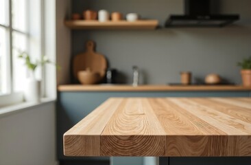 A wooden countertop on a blurry background of the kitchen room.