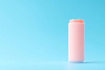 Pink lip balm, cylindrical container, on light blue background
