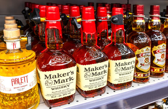 Maker's Mark whisky on the shelf in a superstore. Various bottled strong  alcoholic beverages
