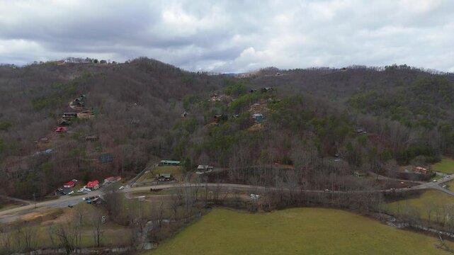 Aerial shot pushing in on cabins in the Tennessee Mountains.