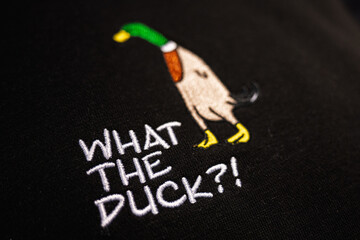 Colorful Embroidery of Duck on Black Fabric with Humorous Text, What the Duck?!