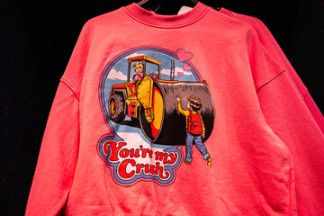Pink sweatshirt with humorous graphic depicting nostalgic construction and love theme Your'e my...