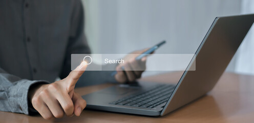 businessman using a laptop, show search bar. concept of a website to find a job and career on the internet	